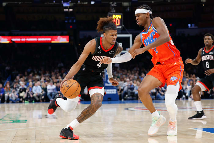 Thunder guard Shai Gilgeous-Alexander defends a drive by Houston Rockets guard Jalen Green during the second quarter at Paycom Center.